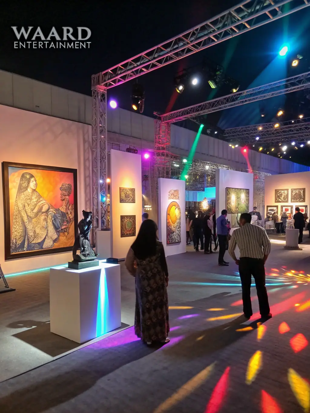 A beautifully decorated venue with thematic banners and decorative lighting for an art exhibition, demonstrating ASS LA BOITE A MATOS's decorative equipment support.
